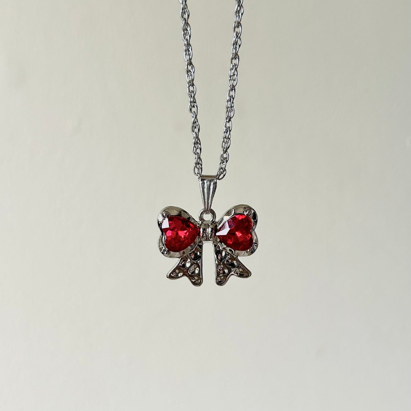 red ribbon necklace