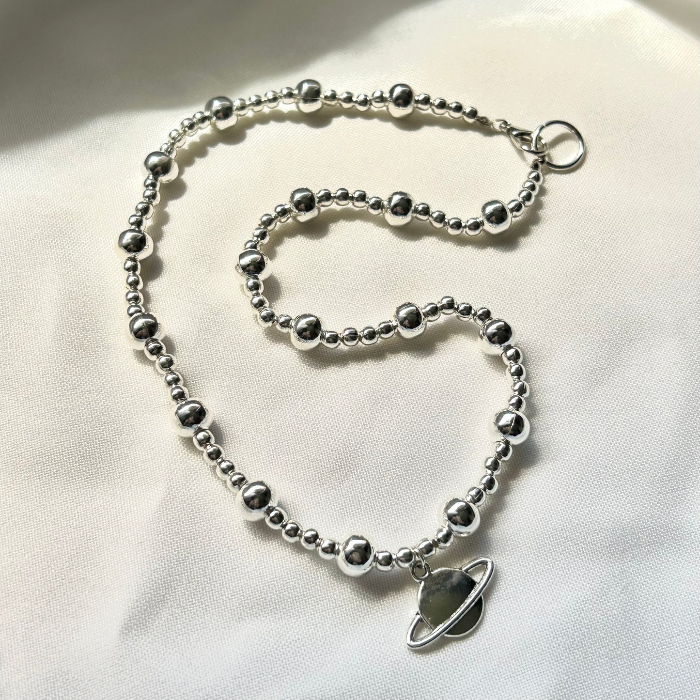 silver saturn necklace